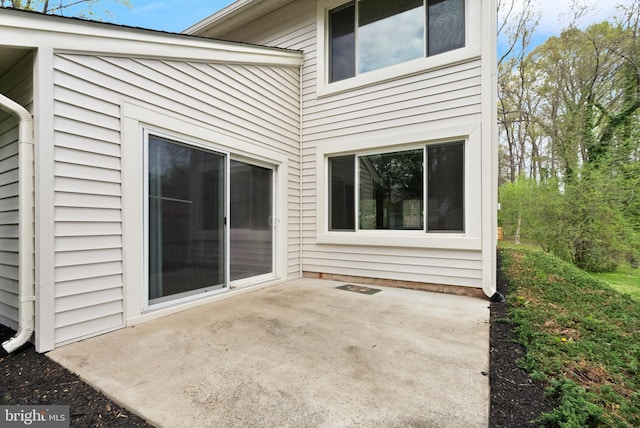 back of property featuring a patio