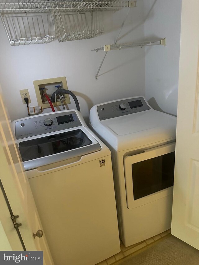 42 Rebecca Ct, Ewing, NJ 08628 - clothes washing area featuring laundry area, tile patterned flooring, and washing machine and dryer