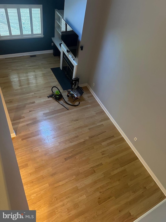 42 Rebecca Ct, Ewing, NJ 08628 - unfurnished living room with baseboards, visible vents, and wood finished floors