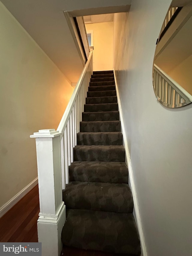 2261 Sidney Ave, Baltimore, MD 21230 - stairs featuring baseboards and wood finished floors
