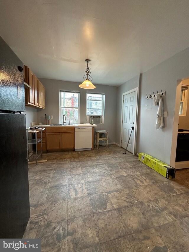 2261 Sidney Ave, Baltimore, MD 21230 - kitchen with freestanding refrigerator, dishwasher, stone finish flooring, and a sink