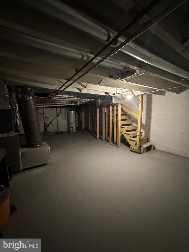2261 Sidney Ave, Baltimore, MD 21230 - unfinished below grade area with stairs and gas water heater