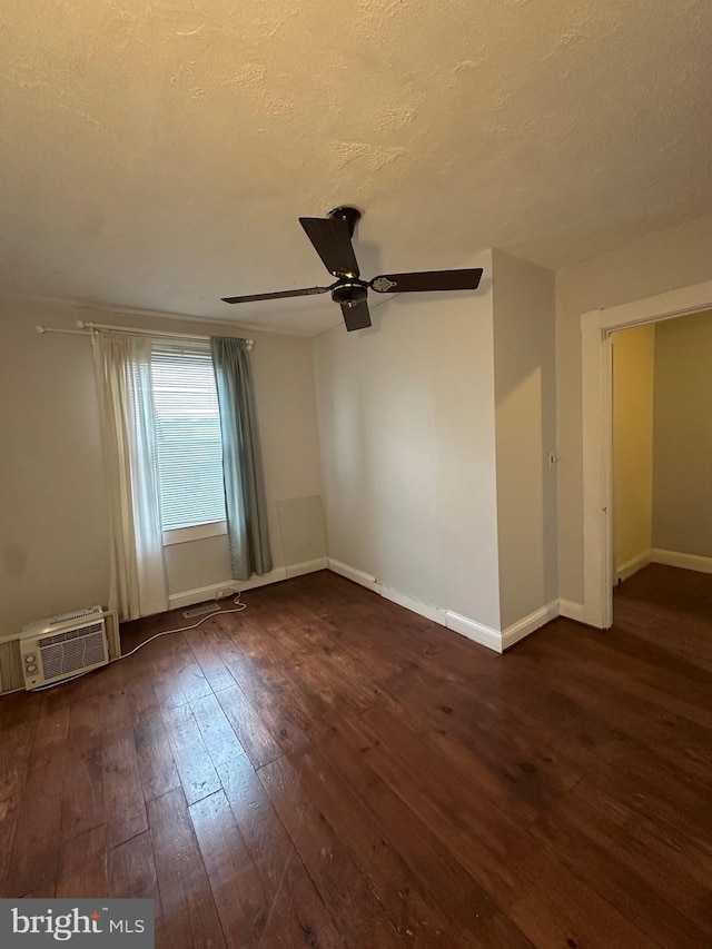 2261 Sidney Ave, Baltimore, MD 21230 - unfurnished room featuring a wall mounted air conditioner, a textured ceiling, ceiling fan, wood-type flooring, and baseboards