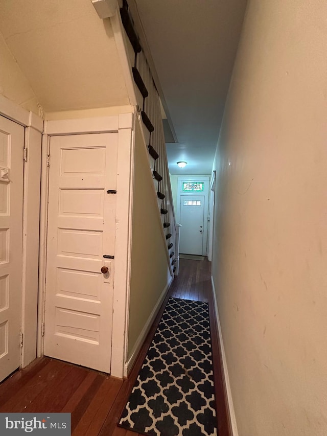 2261 Sidney Ave, Baltimore, MD 21230 - hall with stairway, baseboards, and dark wood-style flooring