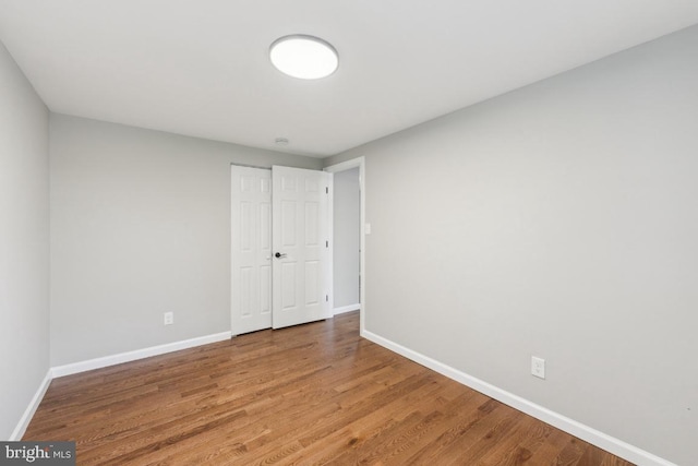 2918 Landover St, Alexandria, VA 22305 - unfurnished bedroom with baseboards, wood finished floors, and a closet