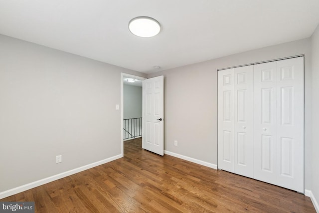 2918 Landover St, Alexandria, VA 22305 - unfurnished bedroom with wood finished floors, a closet, and baseboards
