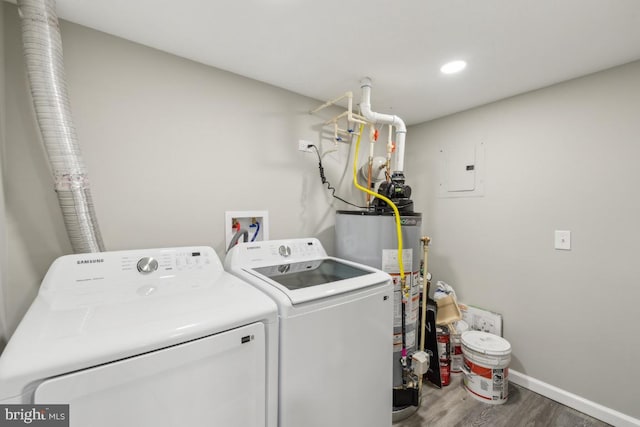 2918 Landover St, Alexandria, VA 22305 - laundry room with washing machine and clothes dryer, wood finished floors, gas water heater, baseboards, and laundry area