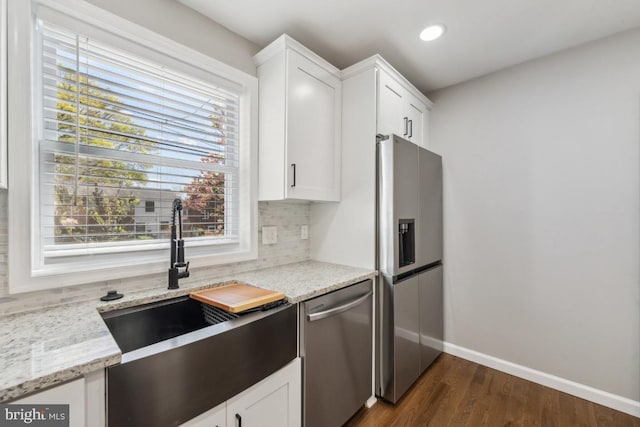 2918 Landover St, Alexandria, VA 22305 - kitchen with a sink, appliances with stainless steel finishes, backsplash, baseboards, and dark wood-style flooring