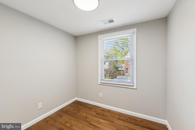 2918 Landover St, Alexandria, VA 22305 - spare room with wood finished floors, visible vents, and baseboards