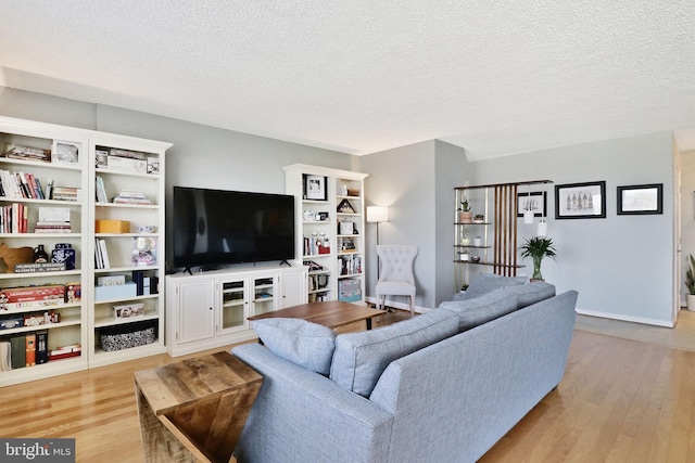 1225 Martha Custis Dr Unit 720, Alexandria, VA 22302 - living area with light wood finished floors and a textured ceiling
