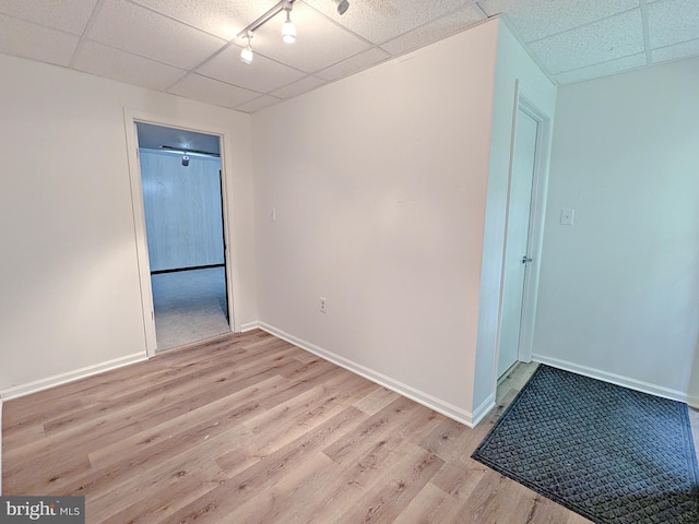 1505 Cedarcrest Ln, Frederick, MD 21702 - empty room with a drop ceiling, light wood finished floors, and baseboards