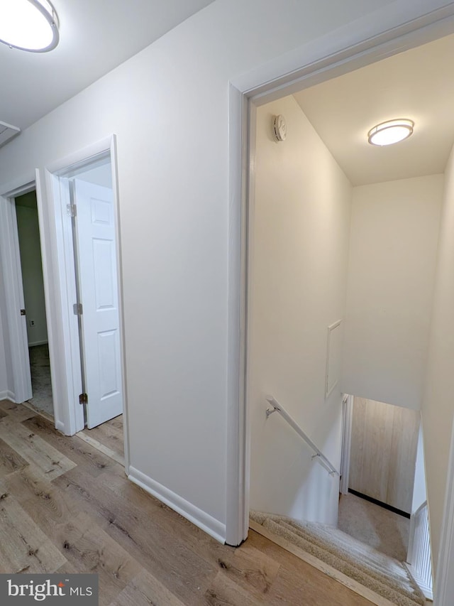 1505 Cedarcrest Ln, Frederick, MD 21702 - corridor with an upstairs landing, light wood-style floors, and baseboards