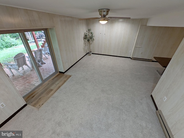 1505 Cedarcrest Ln, Frederick, MD 21702 - unfurnished room with a ceiling fan, wood walls, light colored carpet, baseboard heating, and baseboards