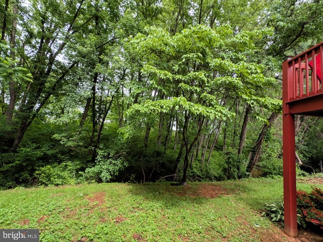 1505 Cedarcrest Ln, Frederick, MD 21702 - view of yard featuring a wooden deck and a wooded view