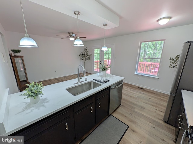 1505 Cedarcrest Ln, Frederick, MD 21702 - kitchen with a sink, appliances with stainless steel finishes, light countertops, and a ceiling fan