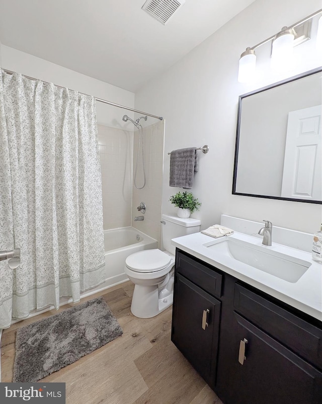 1505 Cedarcrest Ln, Frederick, MD 21702 - full bath with wood finished floors, shower / bath combo, vanity, and toilet