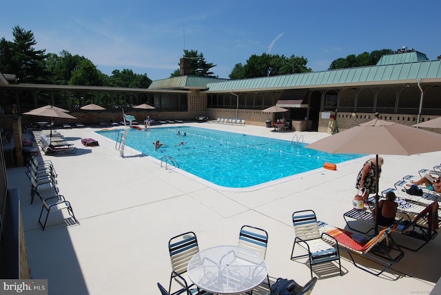 community pool with a patio