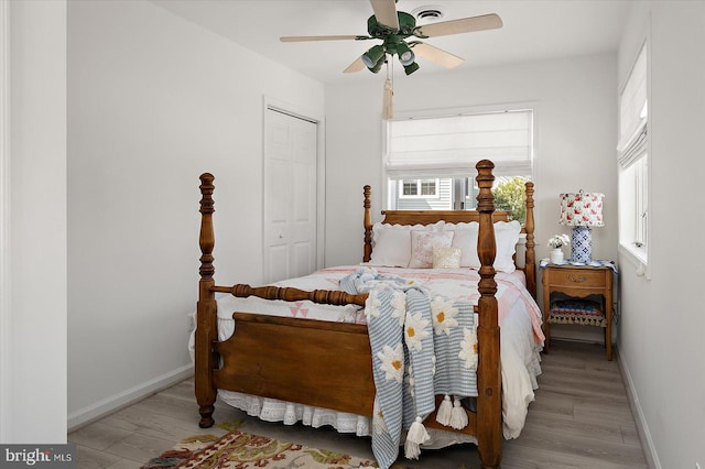 1506 N Bay Shore Dr, Milton, DE 19968 - bedroom featuring a closet, baseboards, a ceiling fan, and wood finished floors