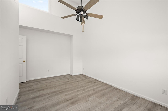 1506 N Bay Shore Dr, Milton, DE 19968 - unfurnished room featuring wood finished floors, baseboards, and a ceiling fan