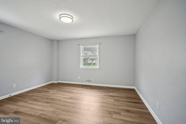 2175 Princeton Pike, Lawrenceville, NJ 08648 - spare room with visible vents, baseboards, and wood finished floors