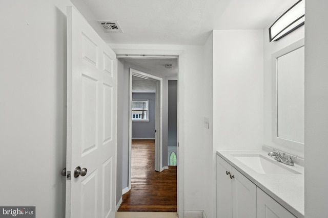 2175 Princeton Pike, Lawrenceville, NJ 08648 - bathroom featuring vanity, visible vents, baseboards, and wood finished floors