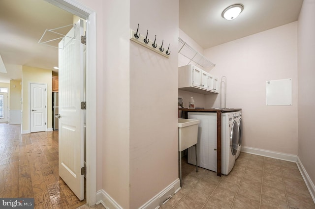 105 Arch St, Milton, DE 19968 - laundry area with cabinet space, independent washer and dryer, and baseboards