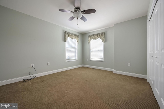 105 Arch St, Milton, DE 19968 - unfurnished bedroom with ceiling fan, a closet, carpet flooring, and baseboards
