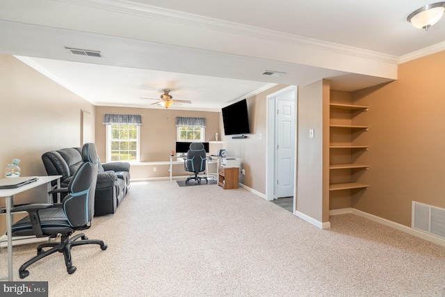 carpeted home office featuring visible vents and crown molding