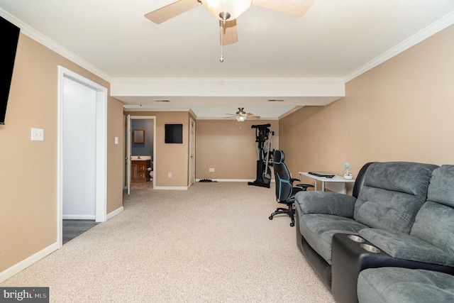 interior space featuring crown molding, ceiling fan, and baseboards
