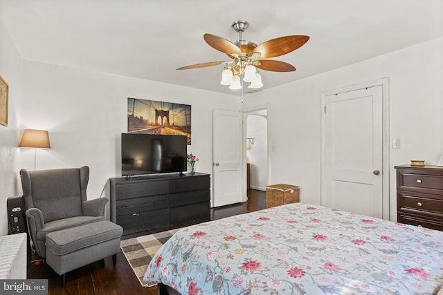 bedroom with a ceiling fan and wood finished floors