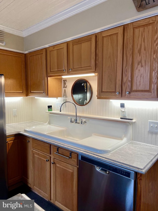 1671 Fravel Rd, Woodstock, VA 22664 - kitchen featuring appliances with stainless steel finishes, brown cabinetry, light countertops, crown molding, and a sink