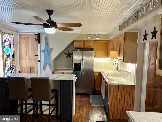 1671 Fravel Rd, Woodstock, VA 22664 - kitchen with stainless steel fridge, light countertops, ceiling fan, a sink, and a breakfast bar area