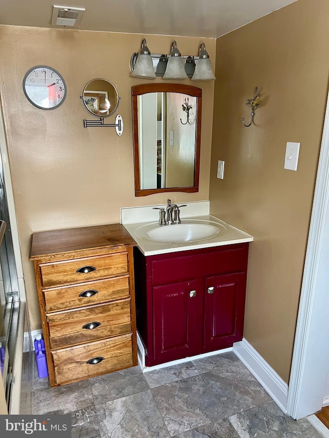 1671 Fravel Rd, Woodstock, VA 22664 - bathroom featuring vanity, stone finish floors, and baseboards
