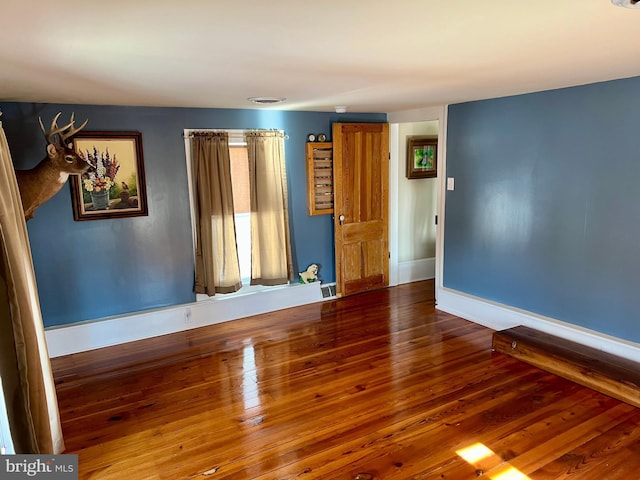 1671 Fravel Rd, Woodstock, VA 22664 - empty room with wood finished floors and baseboards
