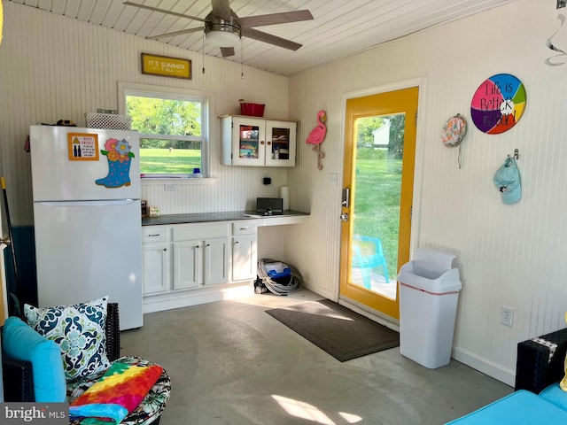 1671 Fravel Rd, Woodstock, VA 22664 - kitchen featuring freestanding refrigerator, finished concrete flooring, ceiling fan, and plenty of natural light