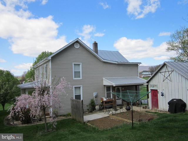 1671 Fravel Rd, Woodstock, VA 22664 - back of property featuring a patio, a chimney, and a yard