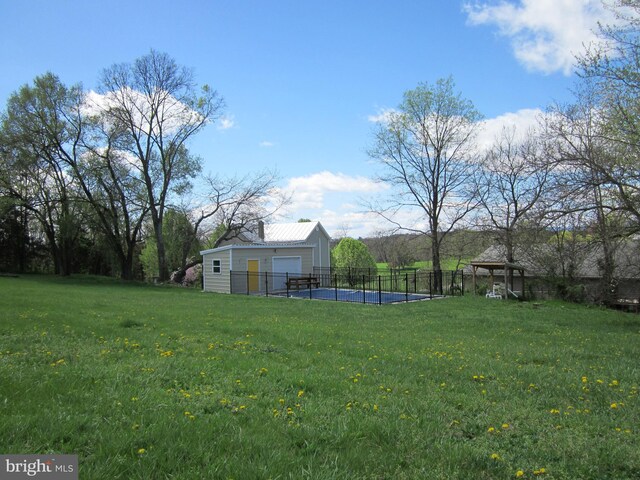 1671 Fravel Rd, Woodstock, VA 22664 - view of yard with an outbuilding and a garage