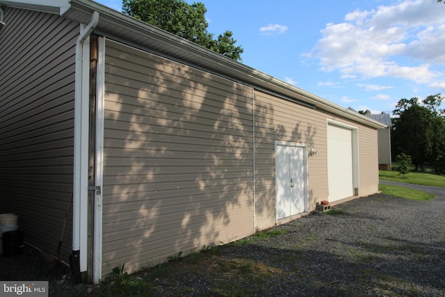 1671 Fravel Rd, Woodstock, VA 22664 - view of property exterior with driveway and a detached garage