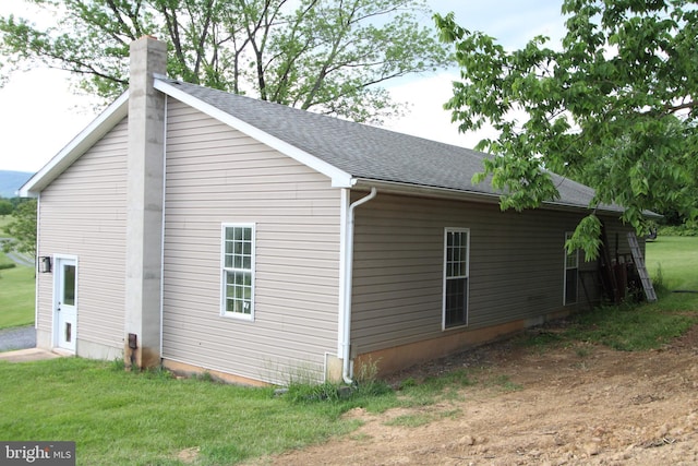 1671 Fravel Rd, Woodstock, VA 22664 - view of property exterior featuring a chimney, roof with shingles, and a lawn