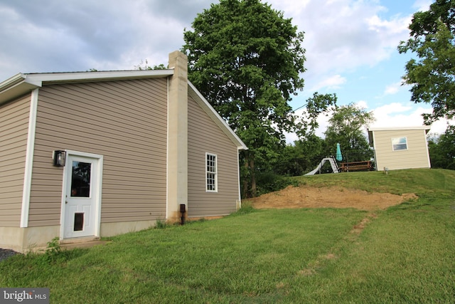 1671 Fravel Rd, Woodstock, VA 22664 - view of side of property with a lawn and a chimney