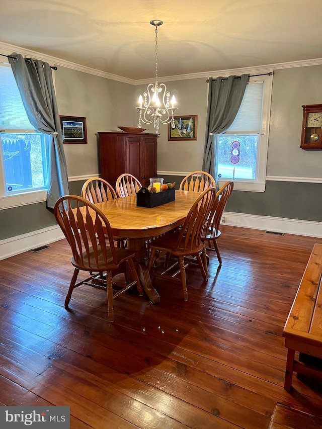 1671 Fravel Rd, Woodstock, VA 22664 - dining room with wood-type flooring, plenty of natural light, ornamental molding, a chandelier, and baseboards