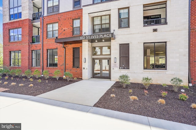 102 Saint Ives Pl Unit 209, National Harbor, MD 20745 - doorway to property with french doors and brick siding