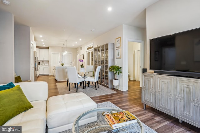 102 Saint Ives Pl Unit 209, National Harbor, MD 20745 - living room featuring recessed lighting, dark wood-style flooring, and baseboards