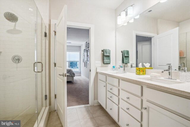 102 Saint Ives Pl Unit 209, National Harbor, MD 20745 - bathroom with a sink, visible vents, a shower stall, and tile patterned flooring