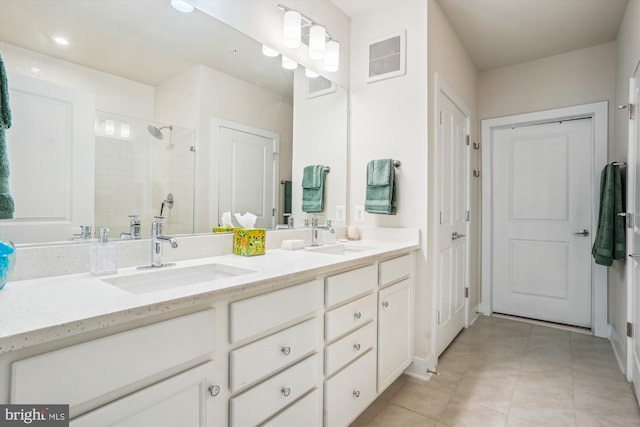 102 Saint Ives Pl Unit 209, National Harbor, MD 20745 - full bath with a shower stall, double vanity, a sink, and visible vents