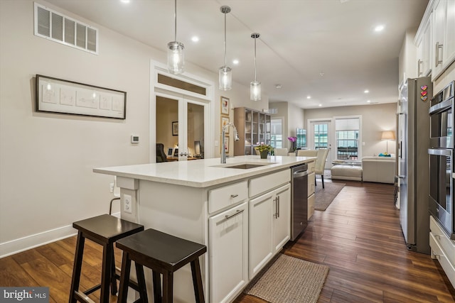 102 Saint Ives Pl Unit 209, National Harbor, MD 20745 - kitchen featuring dark wood finished floors, visible vents, a sink, open floor plan, and french doors