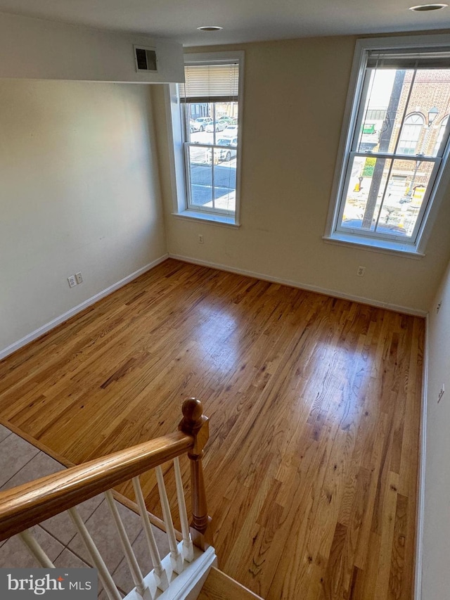 1637 Fleet St, Baltimore, MD 21231 - unfurnished room with visible vents, baseboards, and wood finished floors