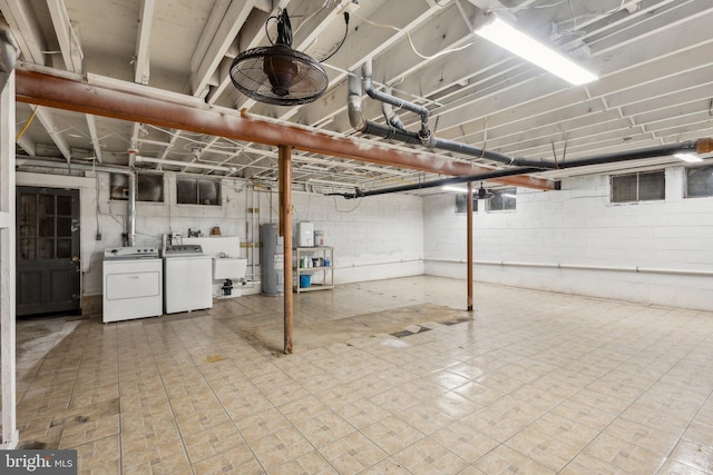 5936 River Dr, Lorton, VA 22079 - unfinished basement with independent washer and dryer, water heater, and a sink