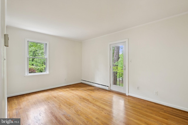 5936 River Dr, Lorton, VA 22079 - unfurnished room featuring a baseboard radiator, healthy amount of natural light, wood finished floors, baseboards, and crown molding