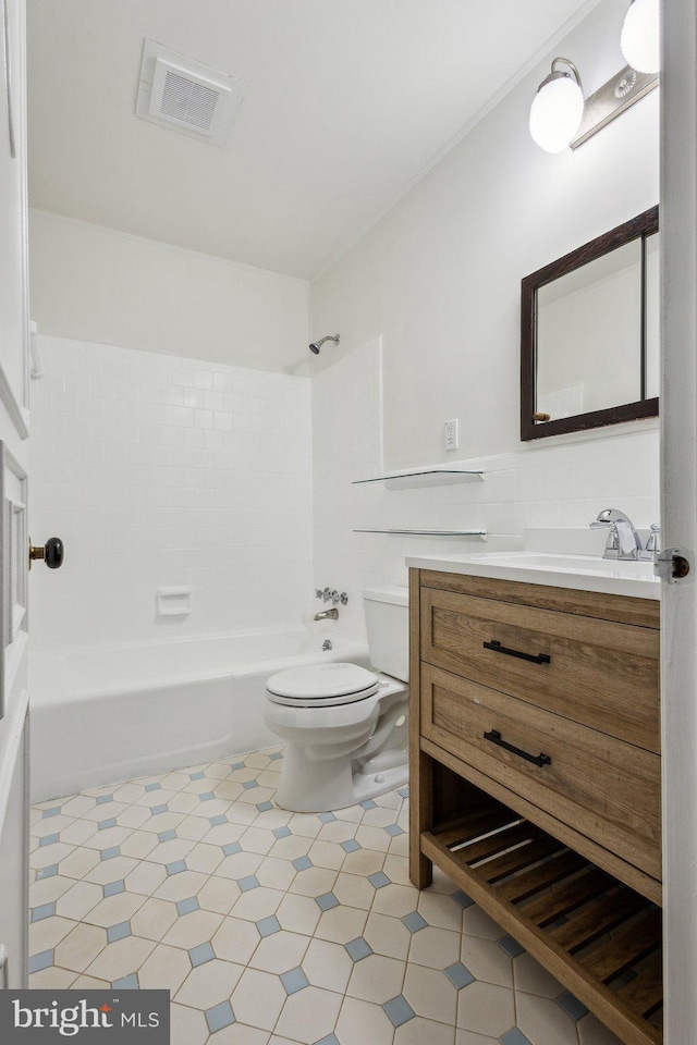 5936 River Dr, Lorton, VA 22079 - bathroom with toilet, vanity, shower / bathtub combination, and tile walls